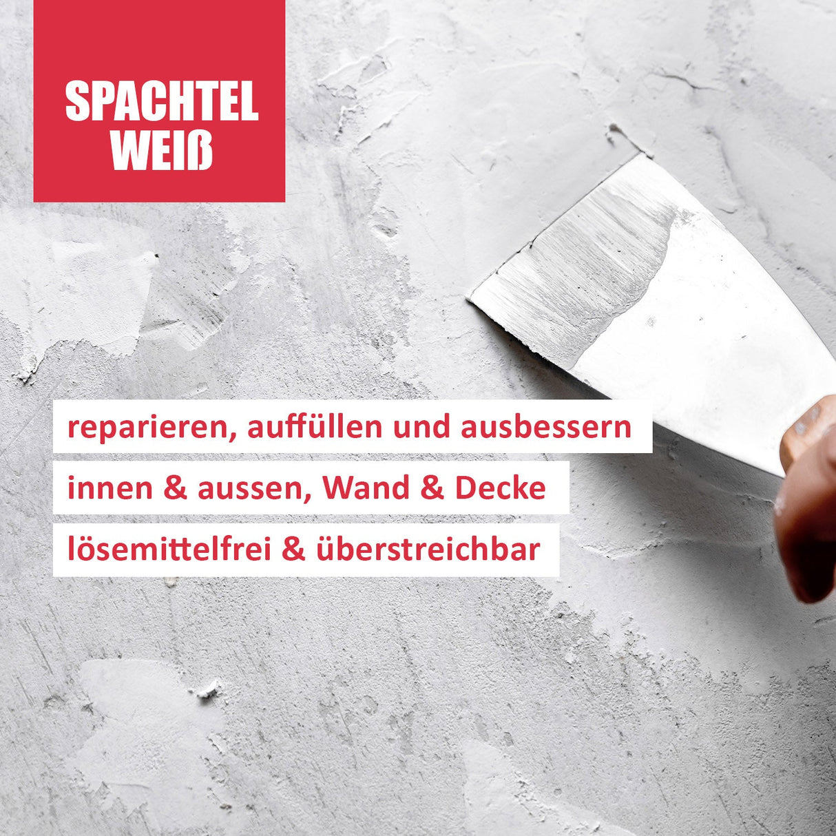 Spachtelmasse auf grauer Oberfläche aufgetragen.