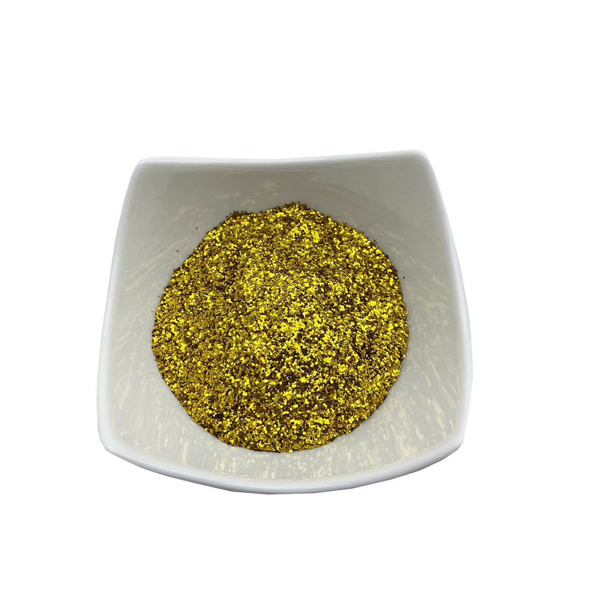 Goldene Glitzerpartikel in Schale.