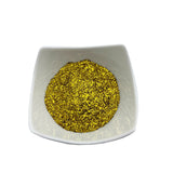 Goldene Glitzerpartikel in Schale.
