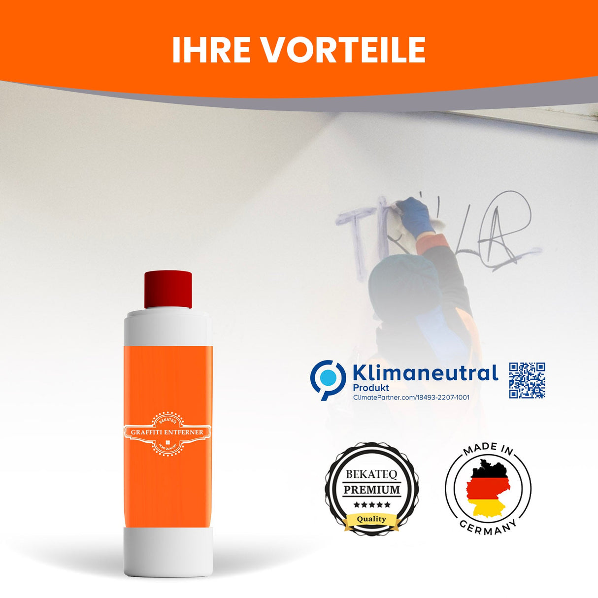 Person entfernt Graffiti mit Reiniger.